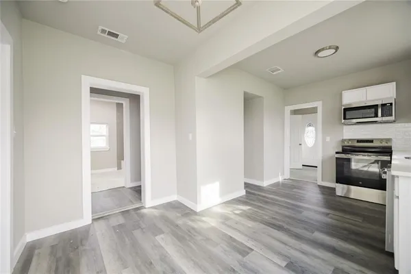 a view of kitchen with microwave and stove