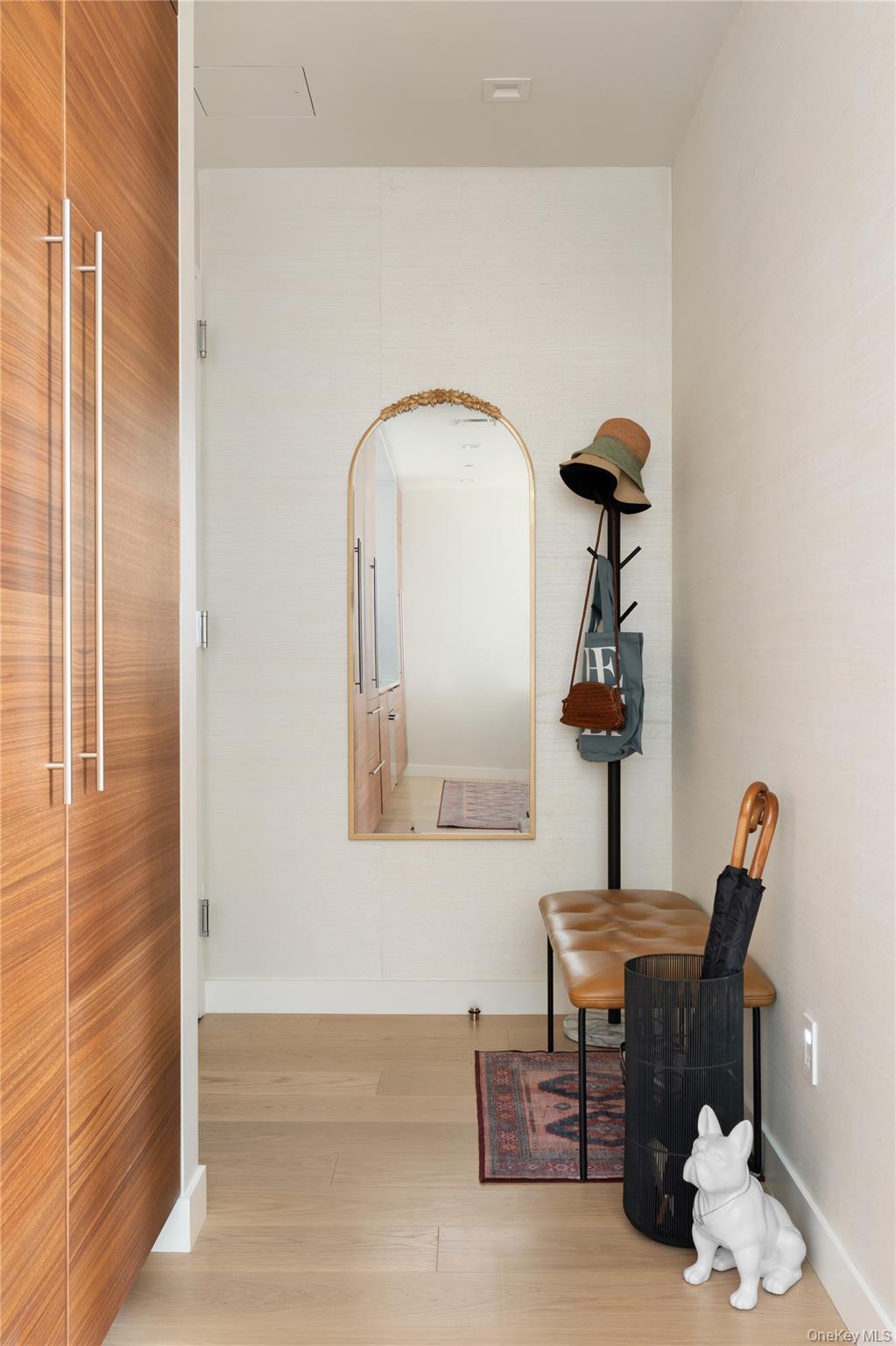 21-21 31st Street, Unit 4E Queens, NY 11105 - Photo 13 of 25 a room with furniture and a window