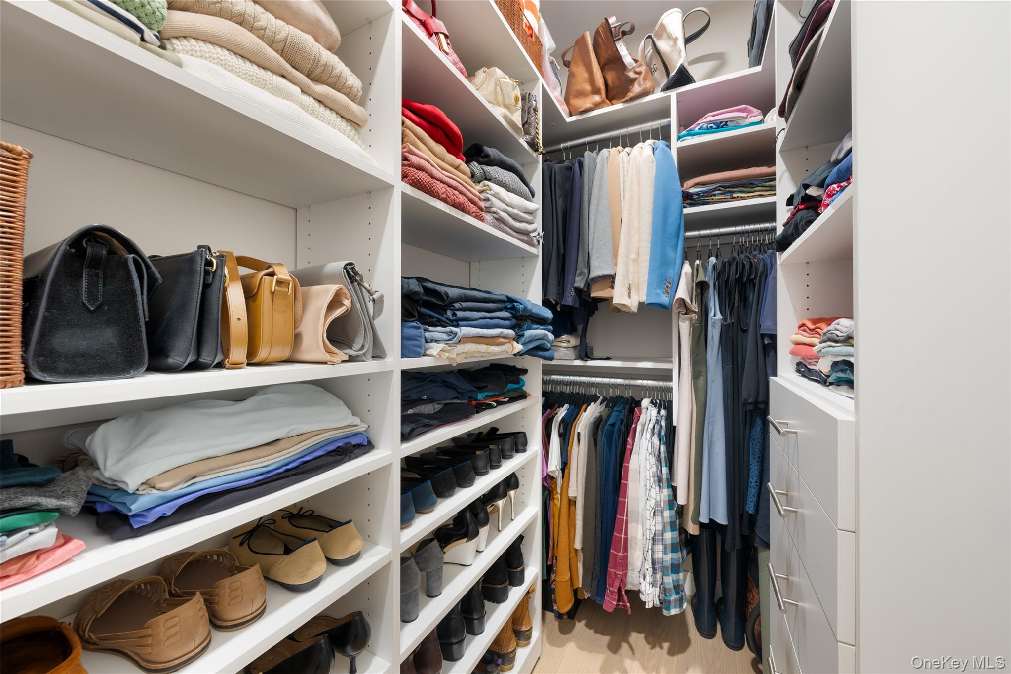21-21 31st Street, Unit 4E Queens, NY 11105 - Photo 16 of 25 a view of walk in closet with clothes and shoes