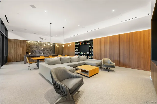 a view of a lobby with furniture and floor to ceiling window