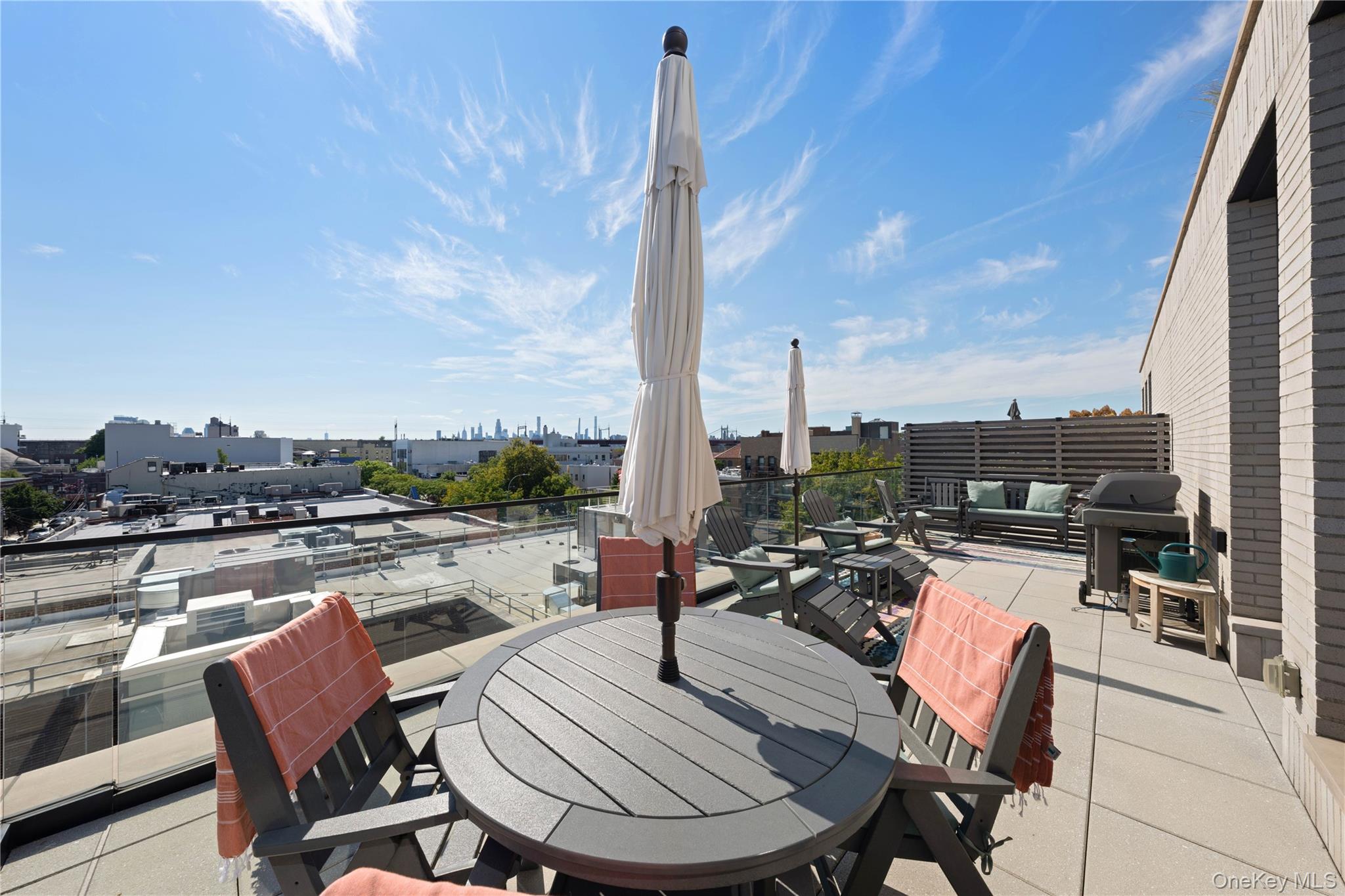 21-21 31st Street, Unit 4E Queens, NY 11105 - Photo 5 of 25 a view of a terrace with furniture
