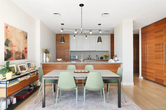 a kitchen with sink stove and cabinets