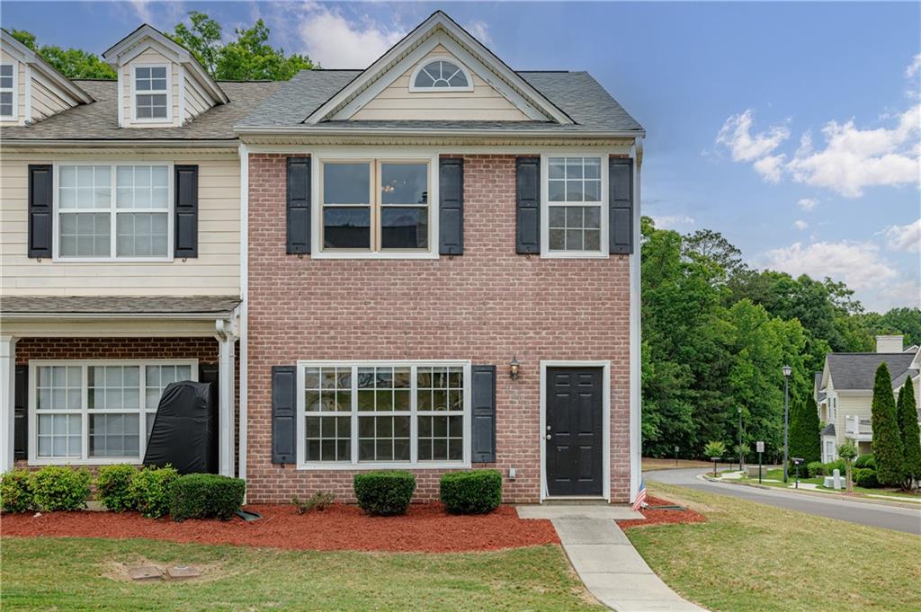 4203 Legacy Square Atlanta, GA 30349 - Photo 5 of 35 a front view of a house with garden