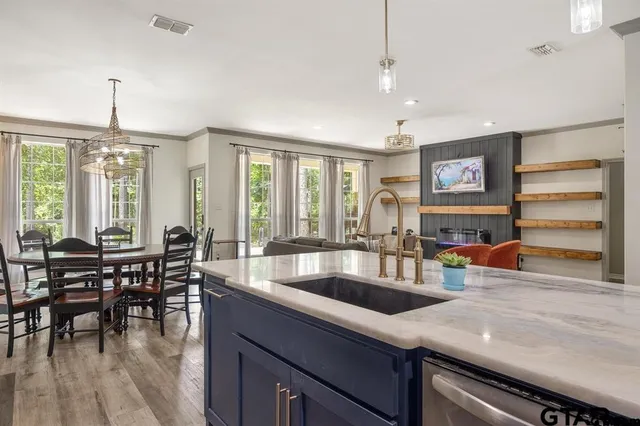 a kitchen with counter top space cabinets and dining table
