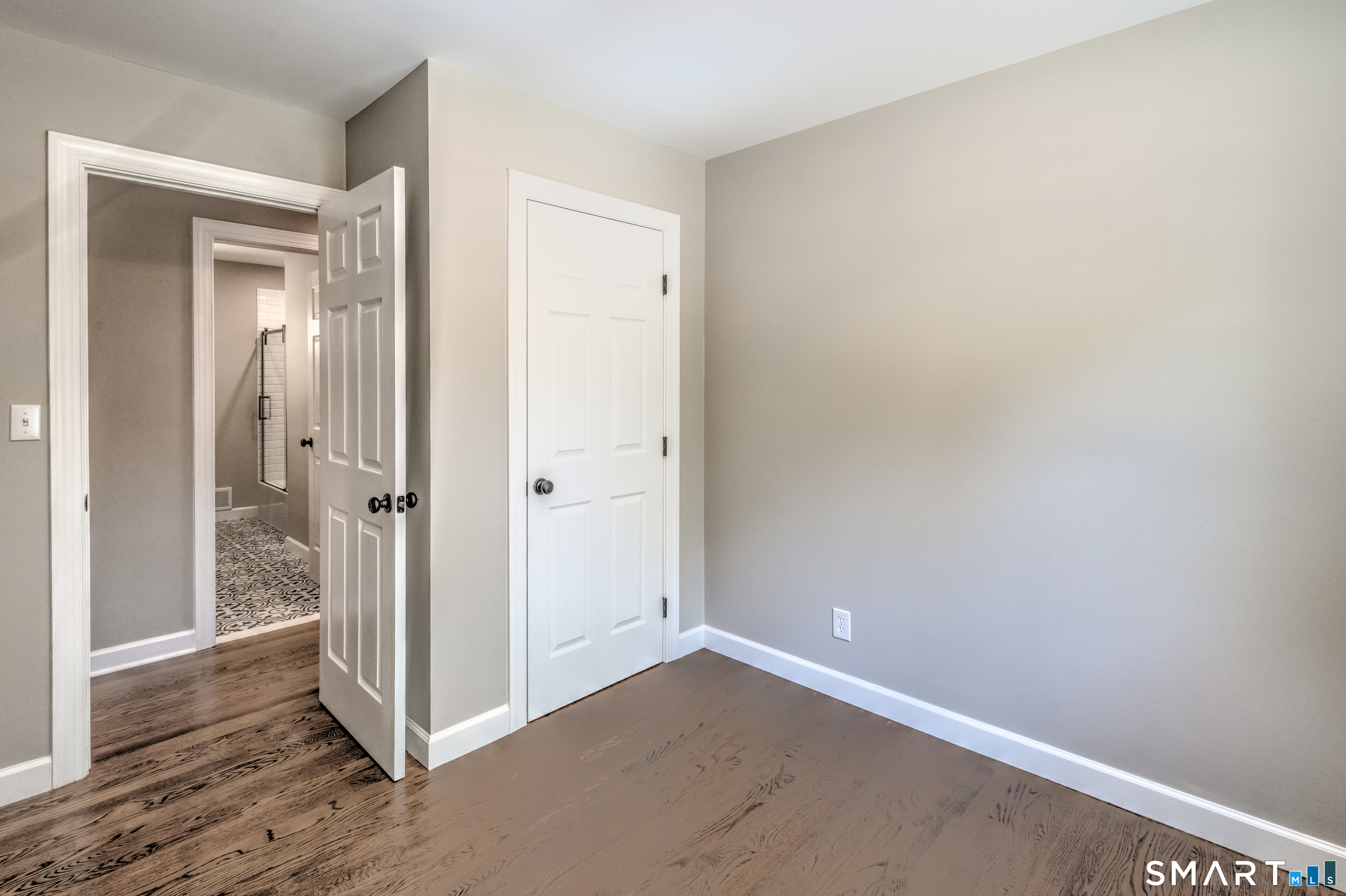437 Middle Rd Turnpike Woodbury, CT 06798 - Photo 7 of 17 an empty room with wooden floor and entrance