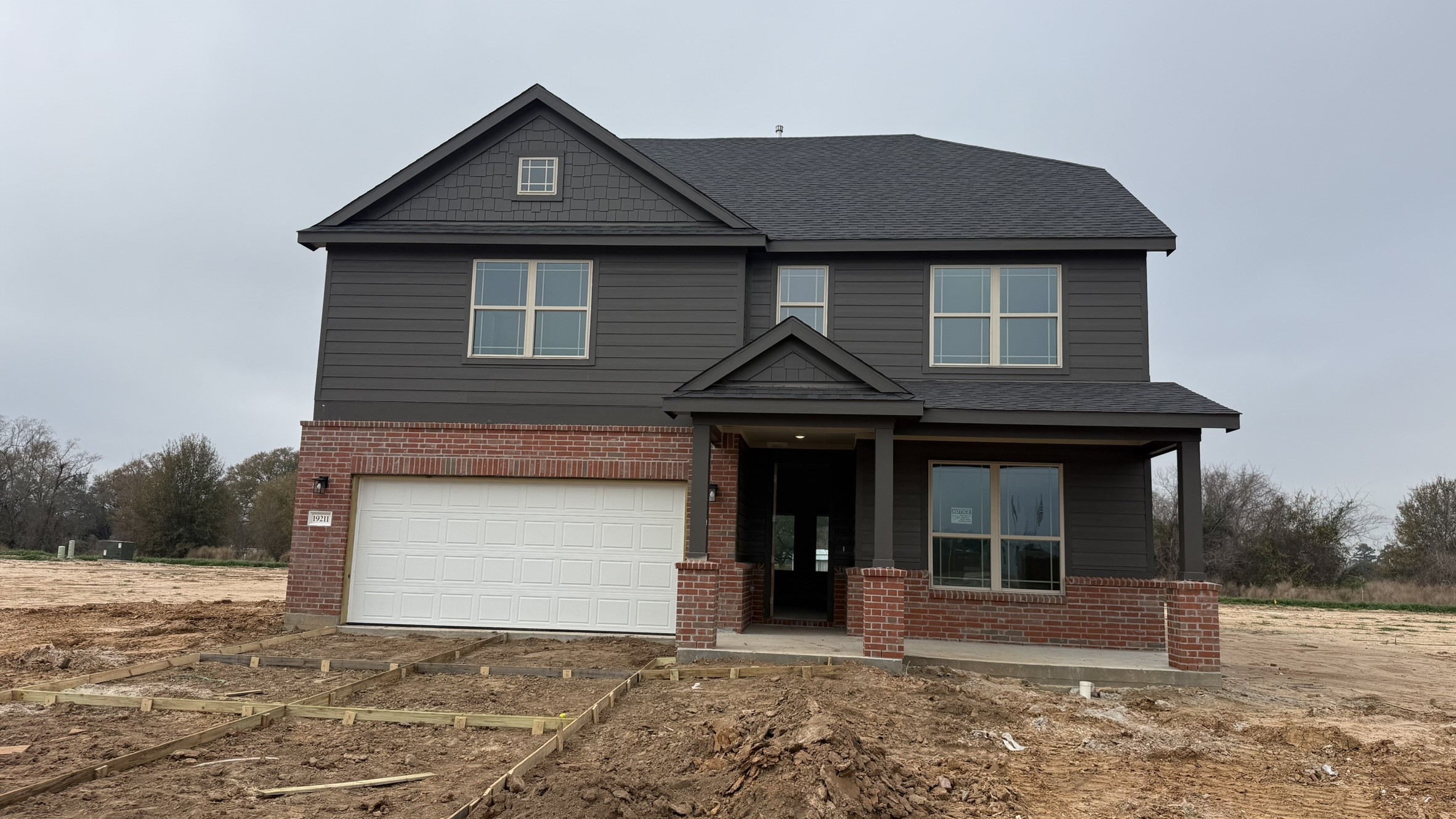 Welcome to the Cypress ll plan by Brohn Homes. Brick to be painted