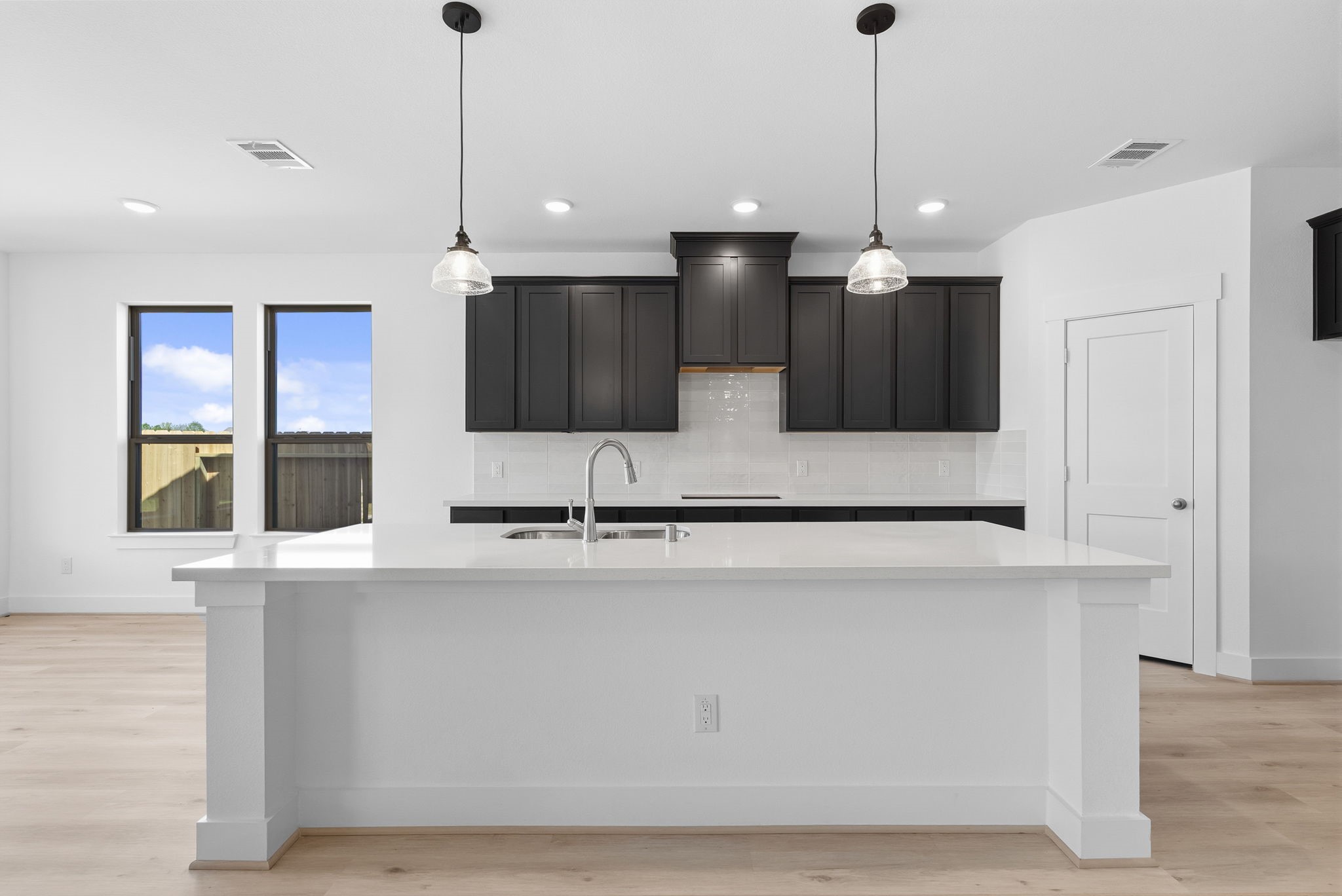 19211 Trinity Terrace Ln Spring Spring, TX 77379 - Photo 11 of 40 a view of a kitchen with a sink and a refrigerator
