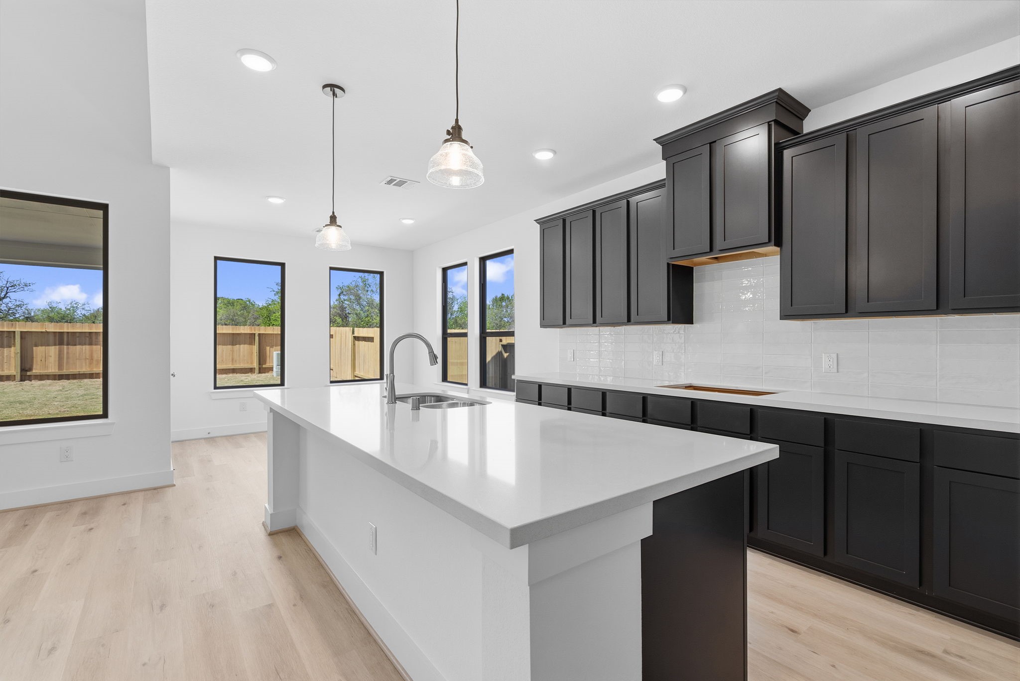 19211 Trinity Terrace Ln Spring Spring, TX 77379 - Photo 12 of 40 a large kitchen with a large center island in it