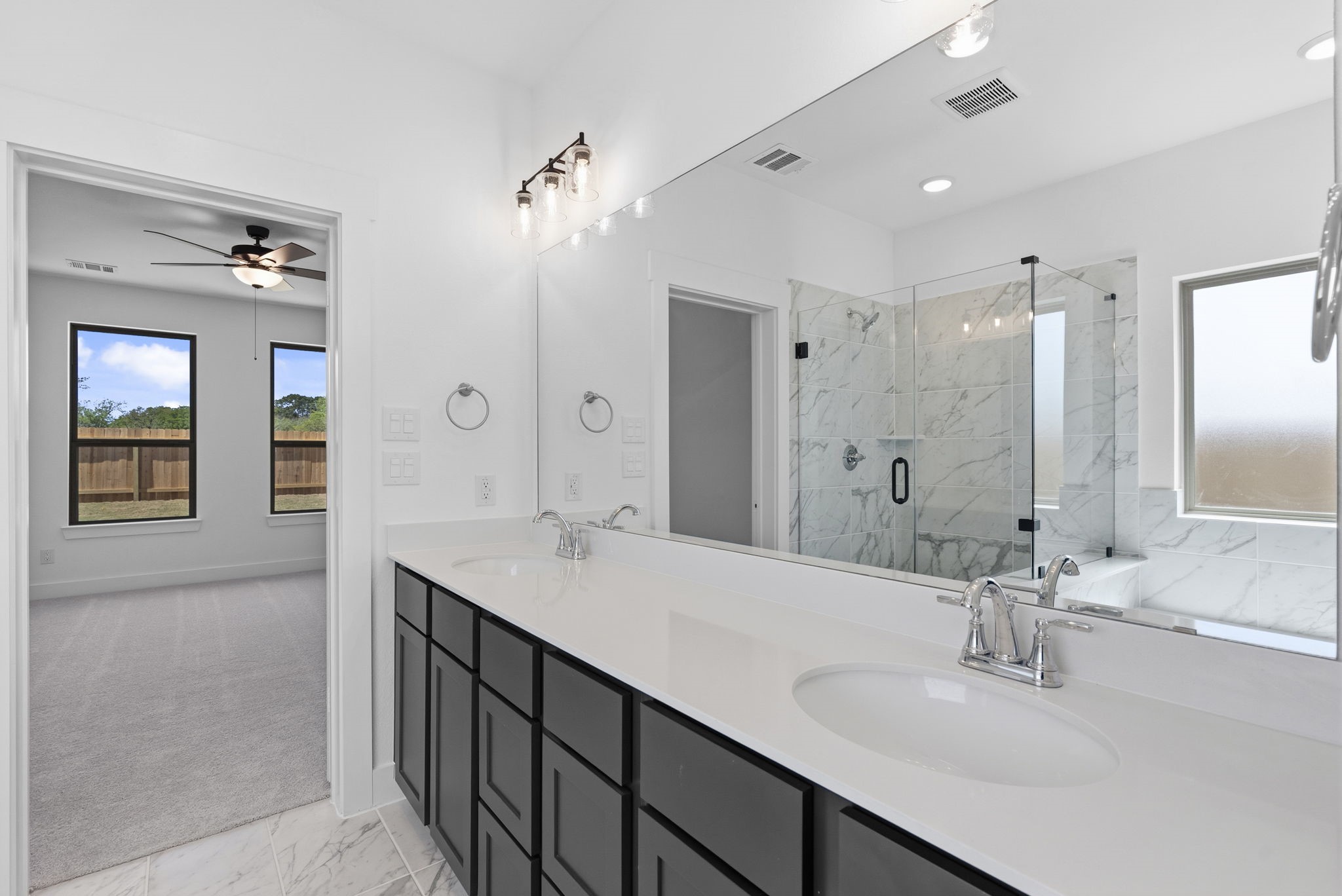 19211 Trinity Terrace Ln Spring Spring, TX 77379 - Photo 25 of 40 a bathroom with a sink tub and a mirror