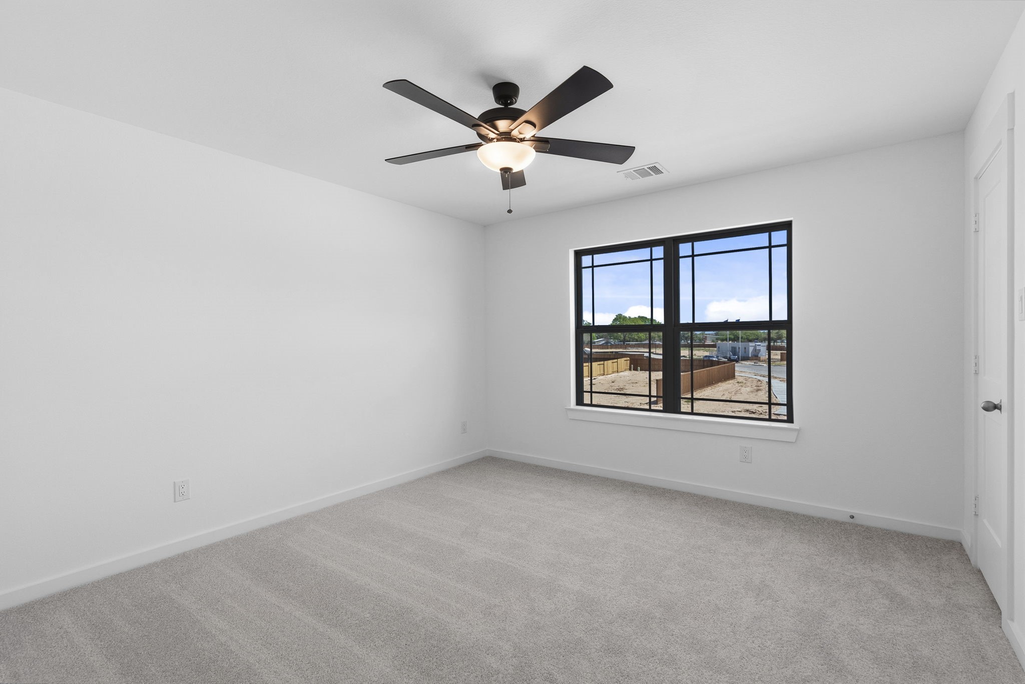 19211 Trinity Terrace Ln Spring Spring, TX 77379 - Photo 26 of 40 an empty room with windows and ceiling fan