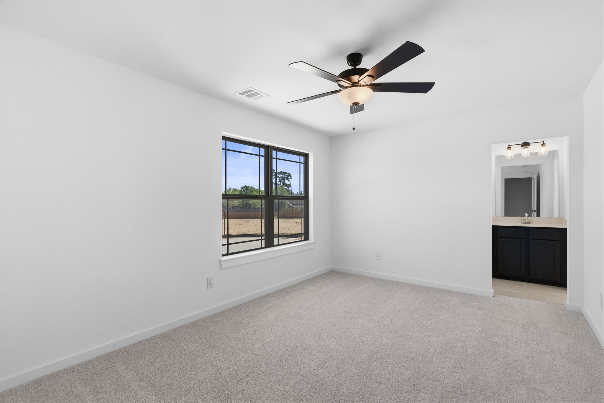 19211 Trinity Terrace Ln Spring Spring, TX 77379 - Photo 27 of 40 a view of an empty room with a window