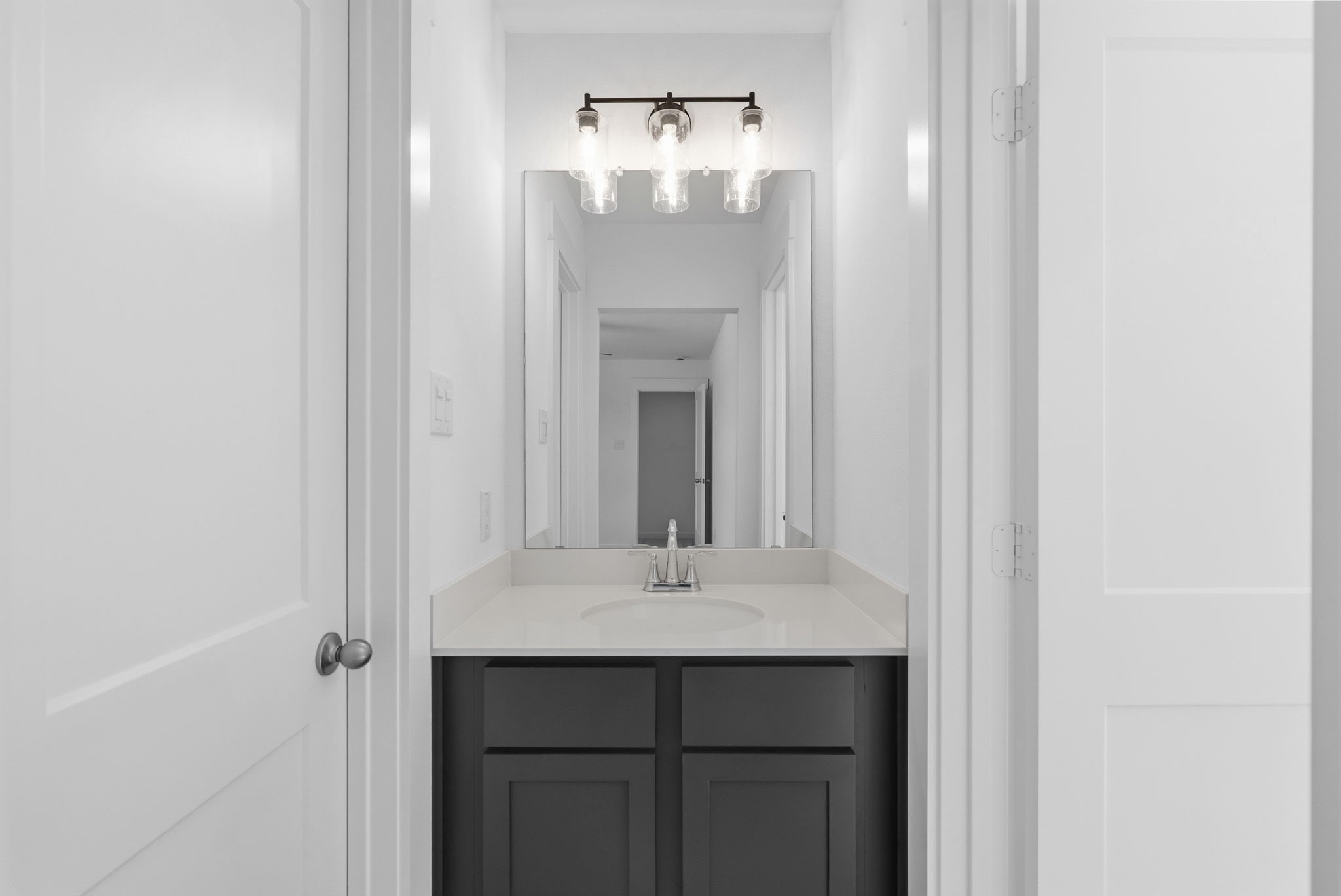 19211 Trinity Terrace Ln Spring Spring, TX 77379 - Photo 28 of 40 a bathroom with a sink and a mirror