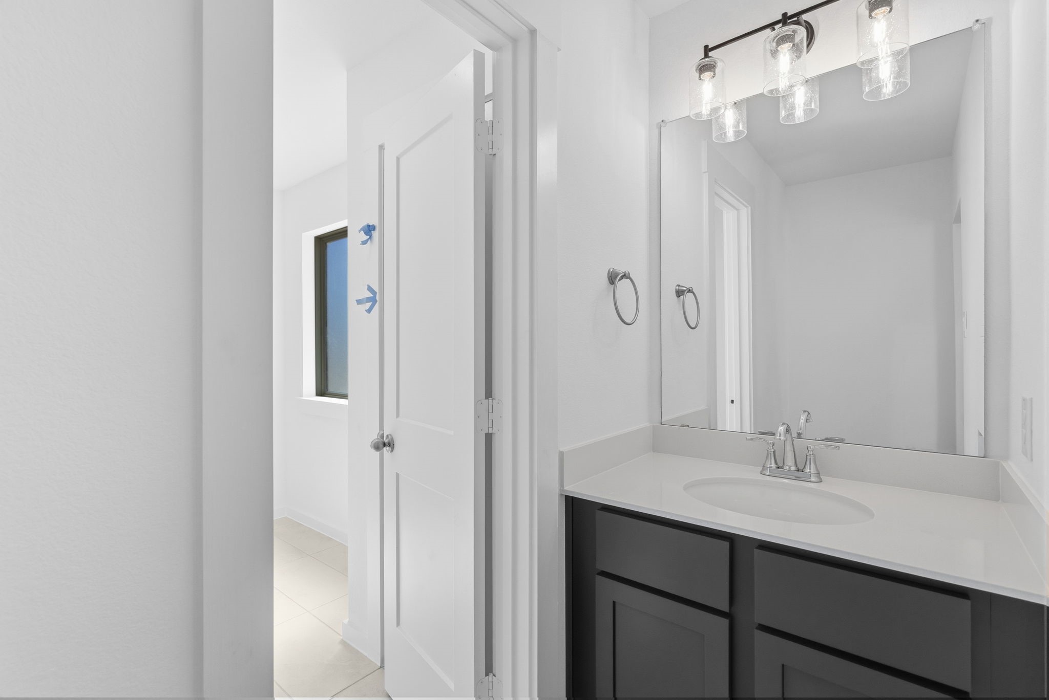 19211 Trinity Terrace Ln Spring Spring, TX 77379 - Photo 30 of 40 a bathroom with a sink double vanity and a mirror