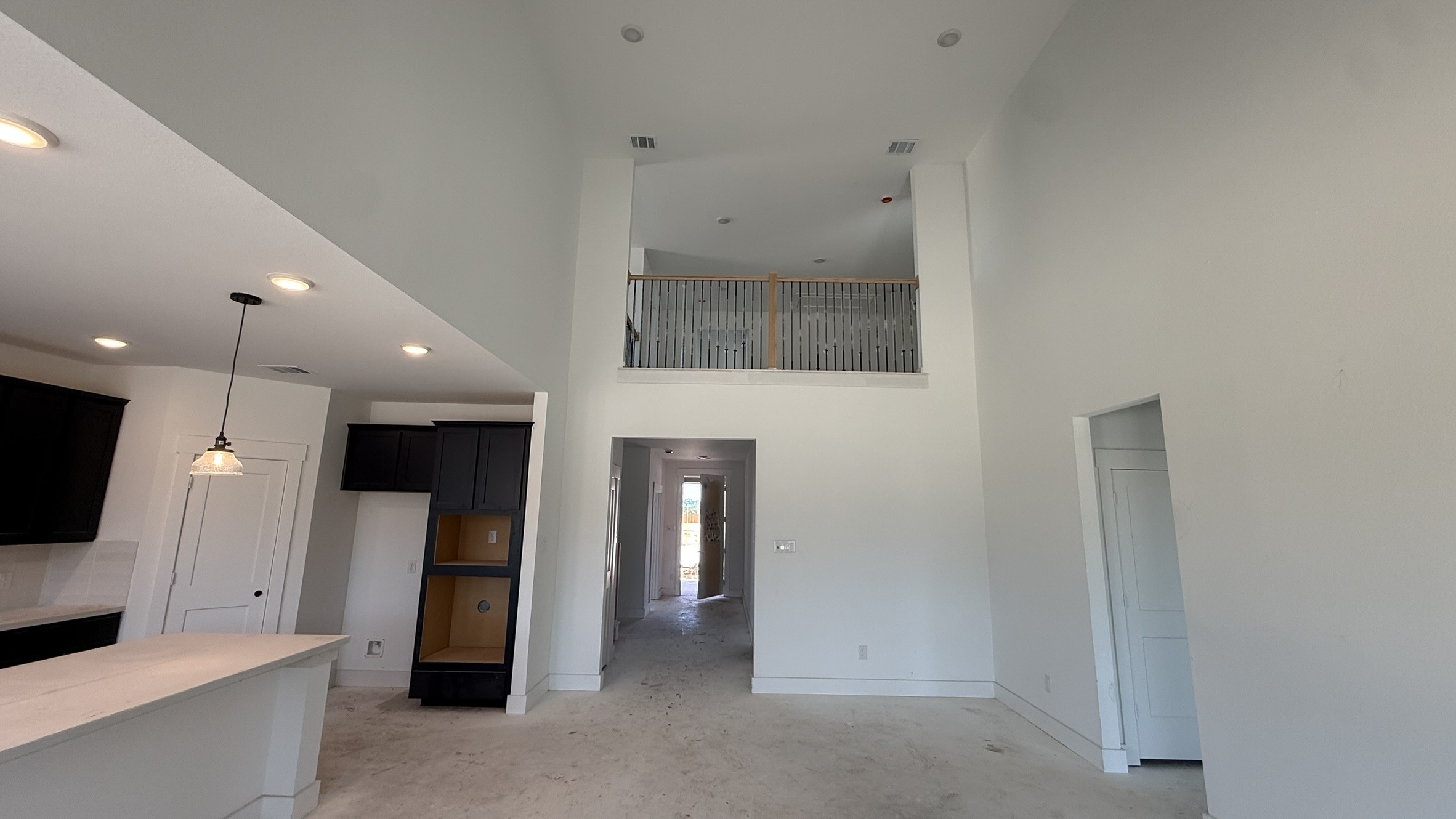 19211 Trinity Terrace Ln Spring Spring, TX 77379 - Photo 3 of 15 Designed for daily life, the family room combines style and comfort, with plenty of room for family activities, cozy evenings, or entertaining guests. Its thoughtful layout and bright ambiance make it a true gathering hub.