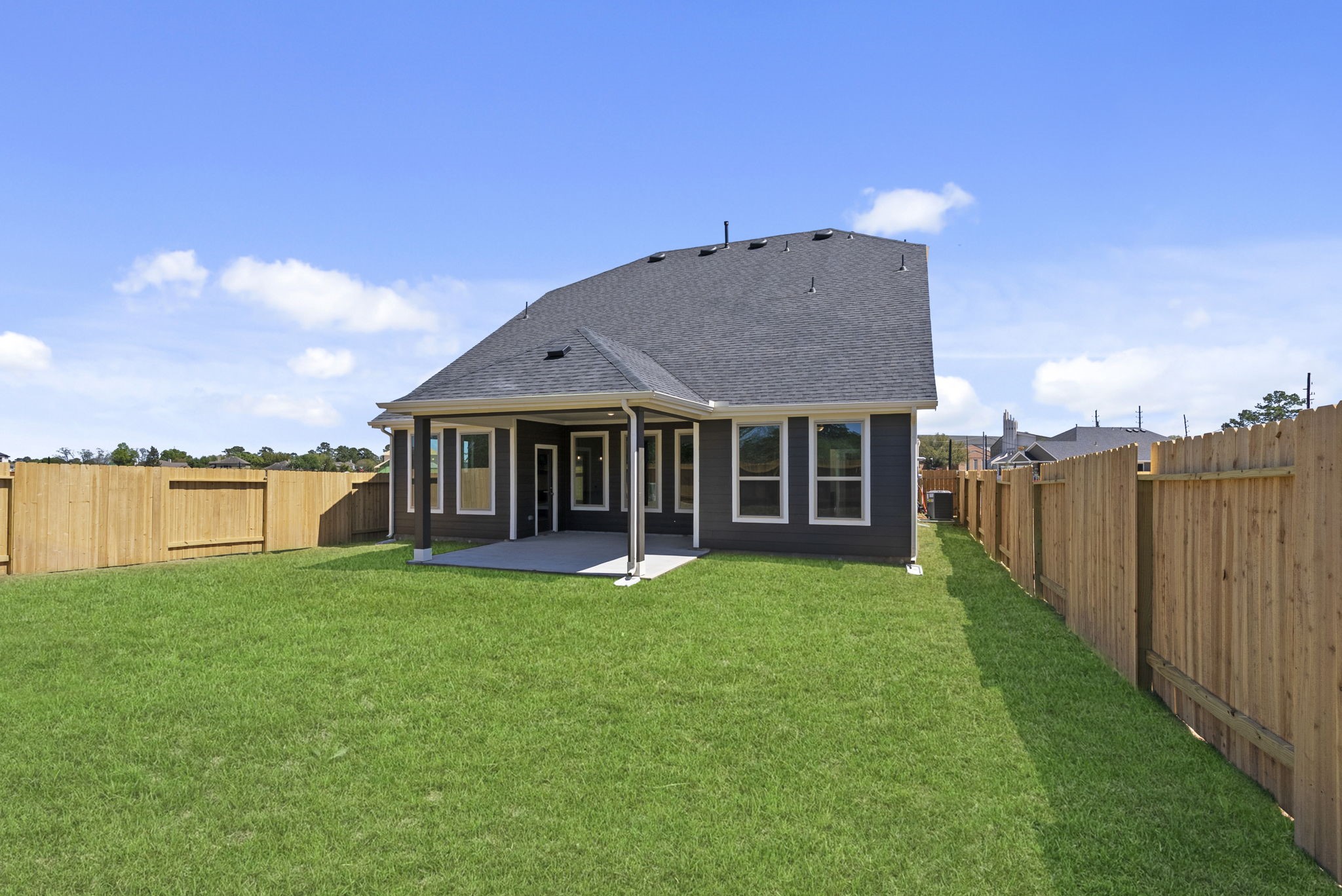 19211 Trinity Terrace Ln Spring Spring, TX 77379 - Photo 32 of 40 a view of a house with swimming pool and a yard