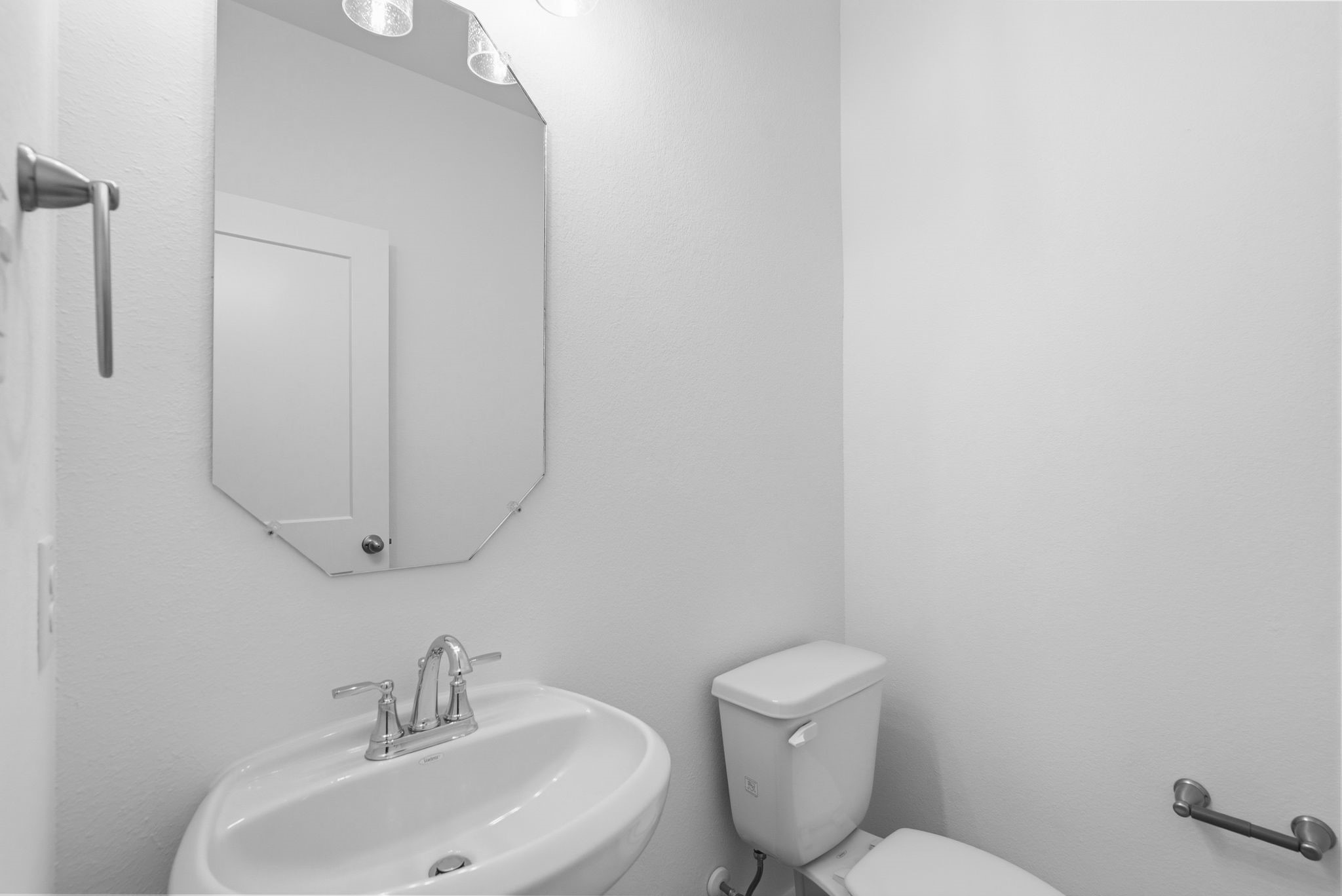 19211 Trinity Terrace Ln Spring Spring, TX 77379 - Photo 7 of 40 a bathroom with a toilet sink and mirror