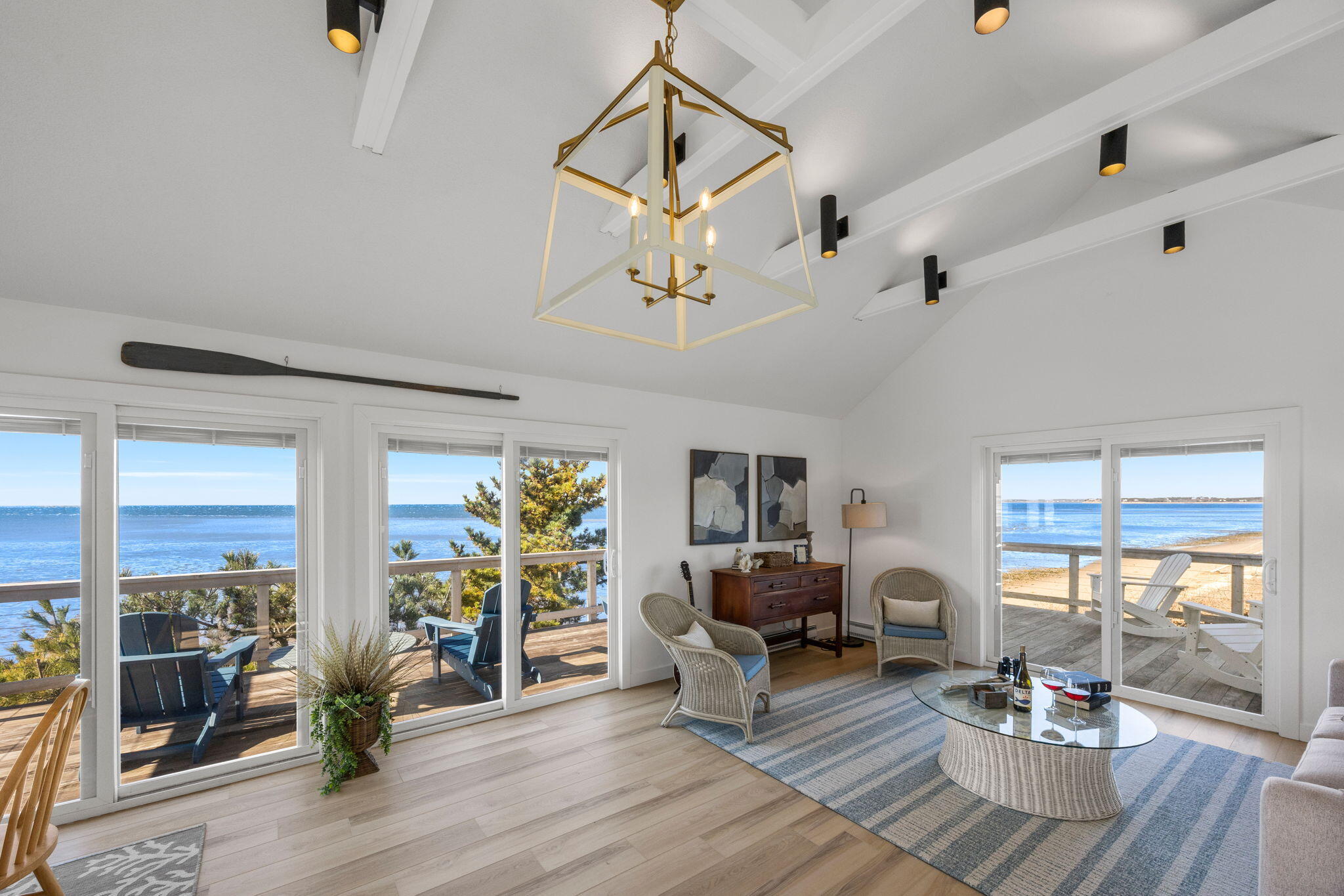 340 Salt Works Road Eastham, MA 02642 - Photo 13 of 52 a living room with couch dining table and wooden floor