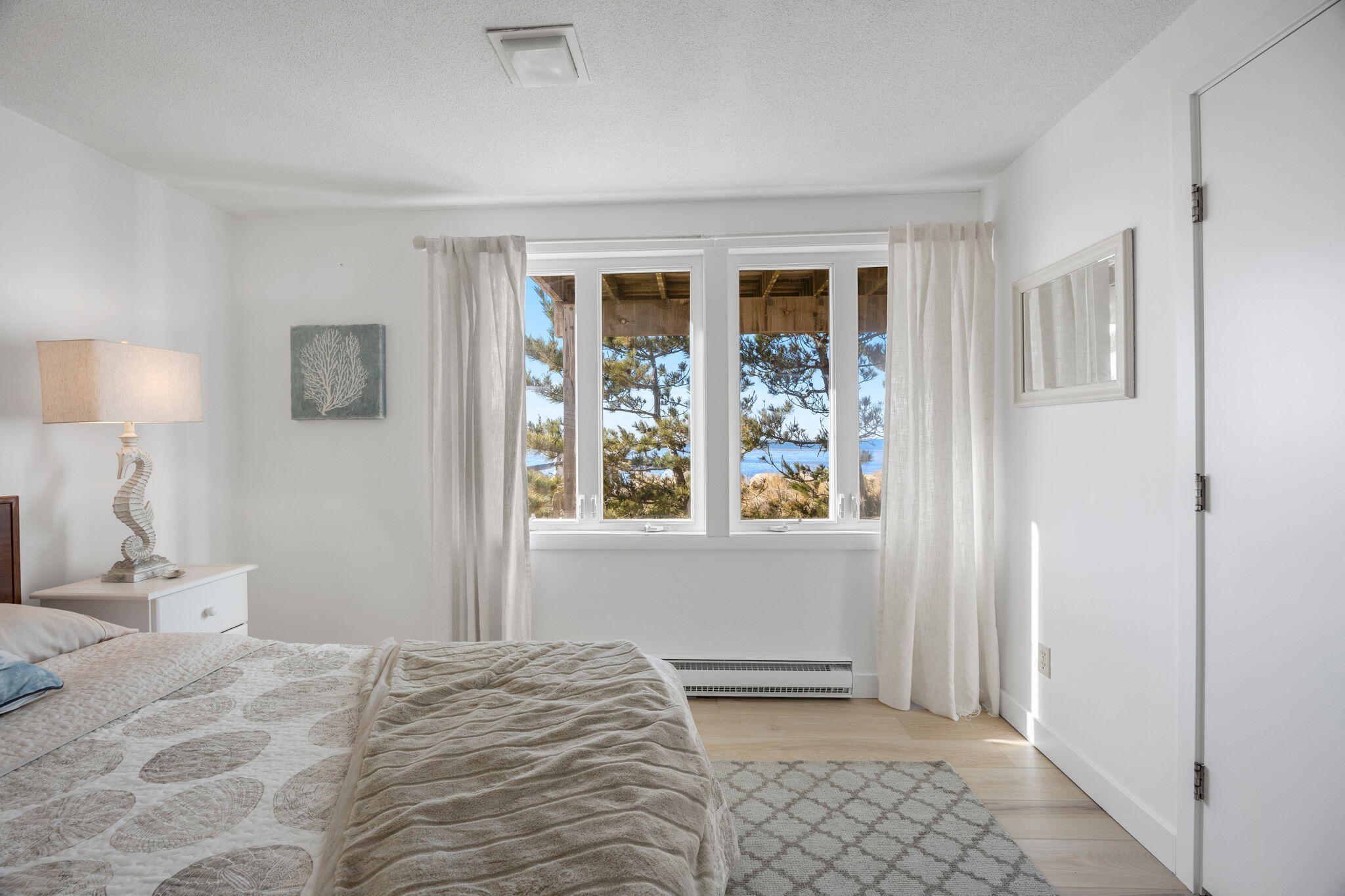 340 Salt Works Road Eastham, MA 02642 - Photo 29 of 52 a bedroom with a bed and a window