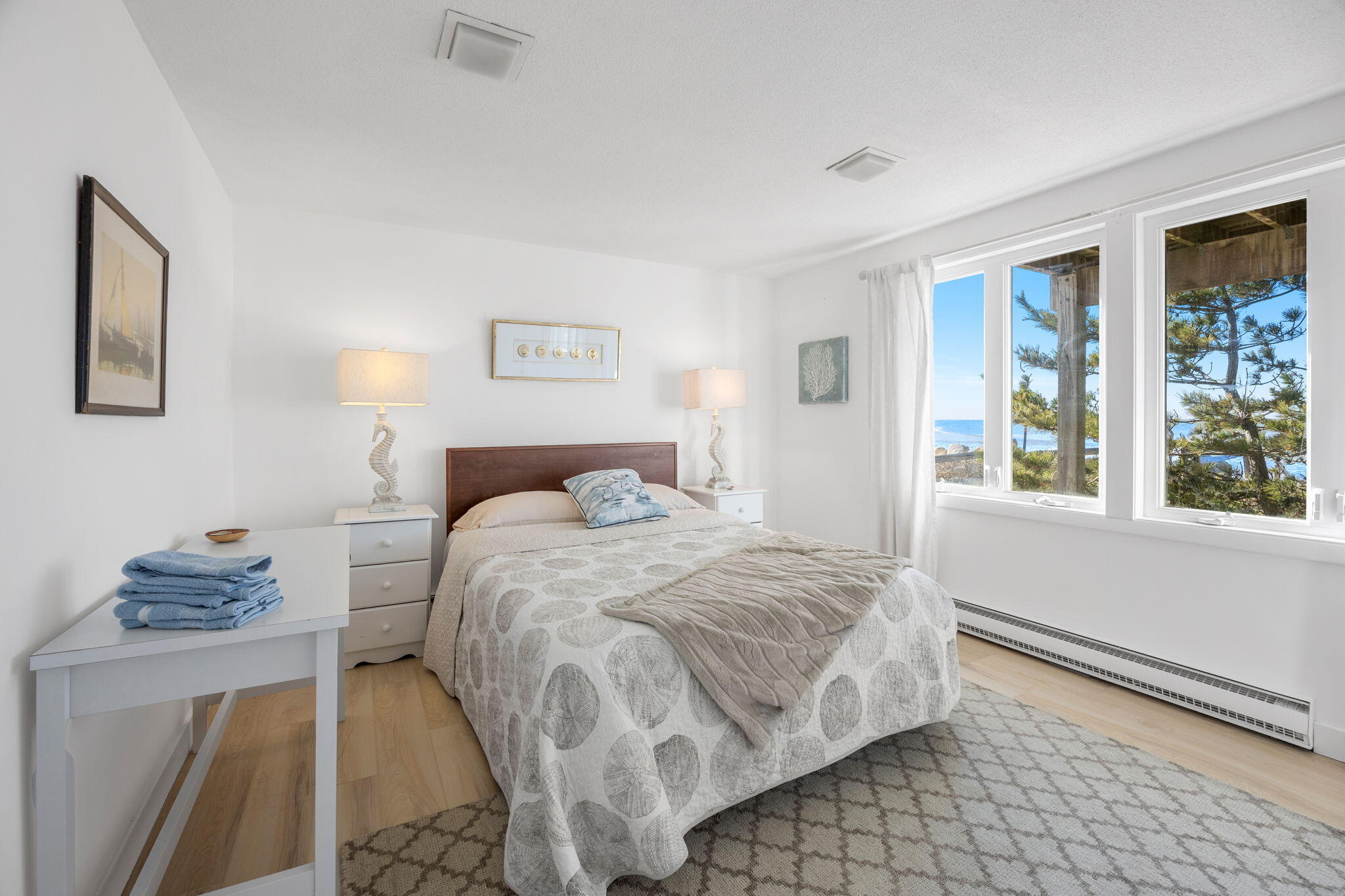 340 Salt Works Road Eastham, MA 02642 - Photo 30 of 52 a bedroom with a bed and a window