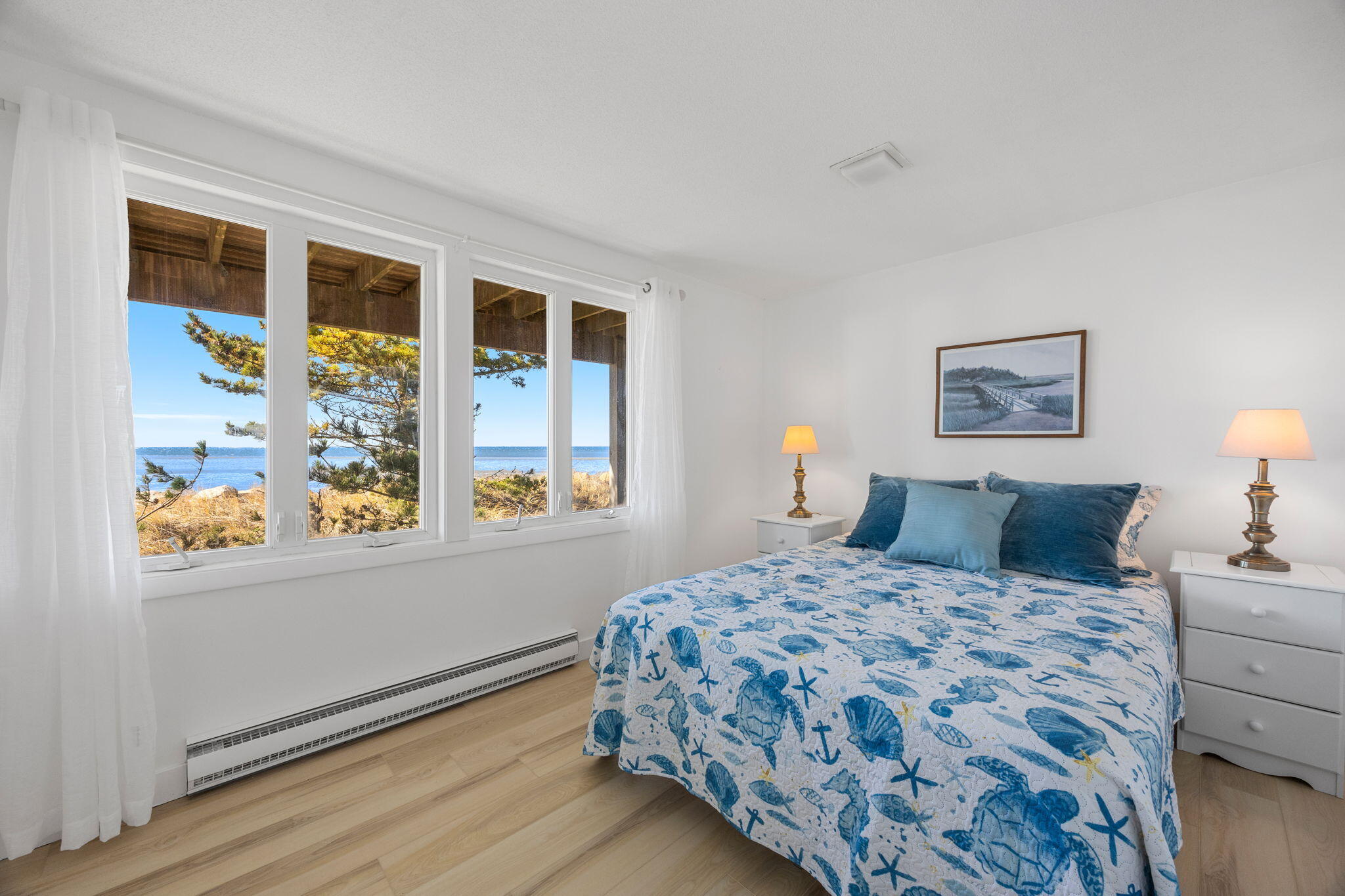 340 Salt Works Road Eastham, MA 02642 - Photo 36 of 52 a bedroom with a bed and a window