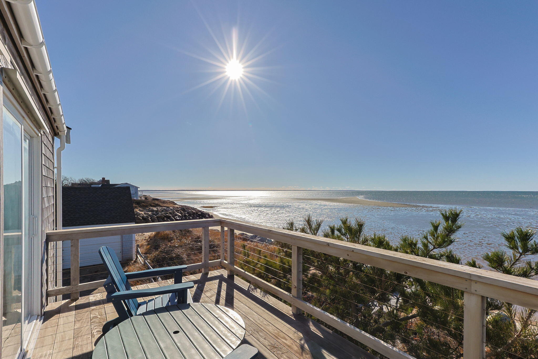 340 Salt Works Road Eastham, MA 02642 - Photo 40 of 52 a view of a roof deck with wooden floor and seating space