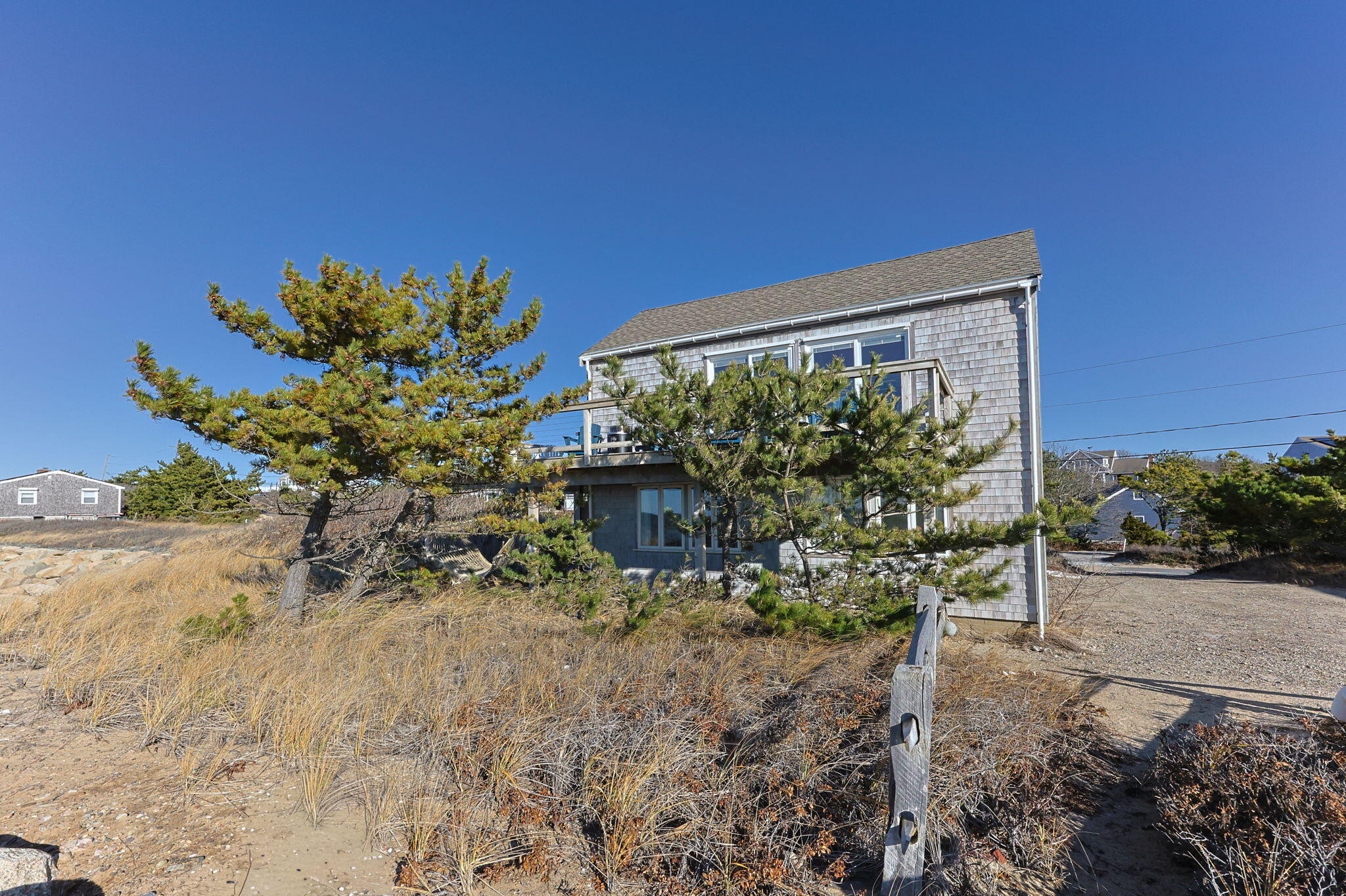 340 Salt Works Road Eastham, MA 02642 - Photo 44 of 52 a front view of a house with a yard