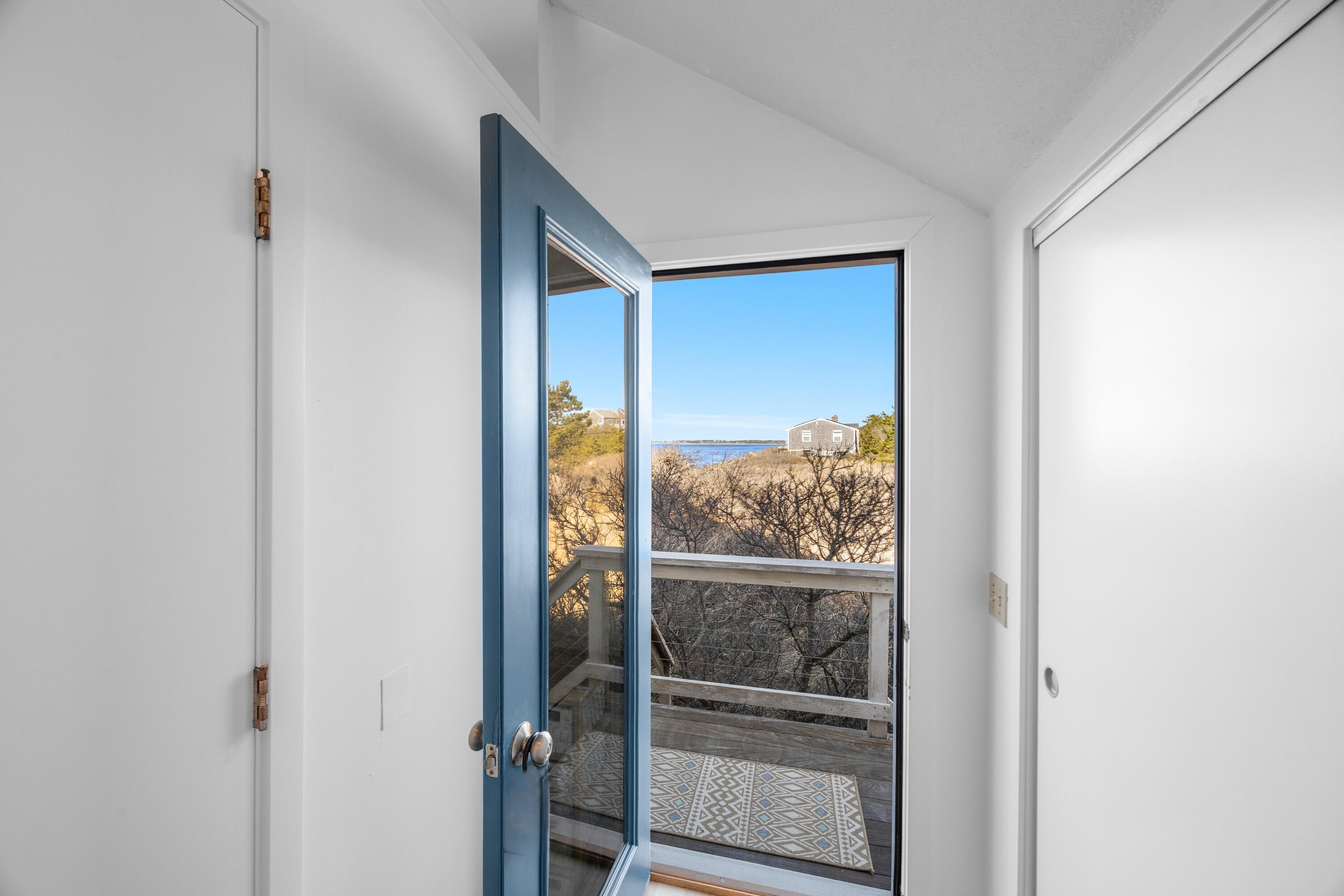 340 Salt Works Road Eastham, MA 02642 - Photo 7 of 52 a view of a room that has a window in it