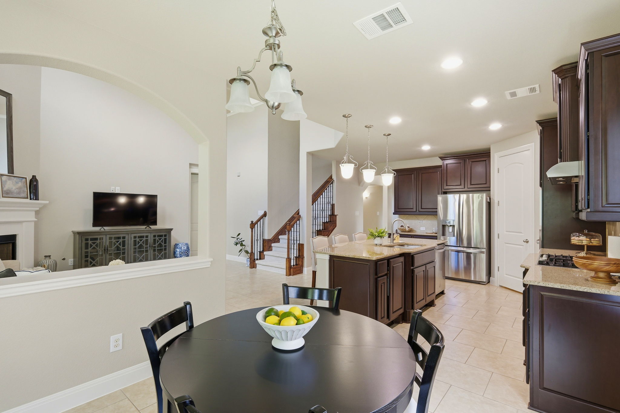 110 Dasher Drive Cedar Park, TX 78613 - Photo 13 of 39 Granite counters and stainless steel appliances outfit this functional kitchen, flowing into an open dining area and beyond.
