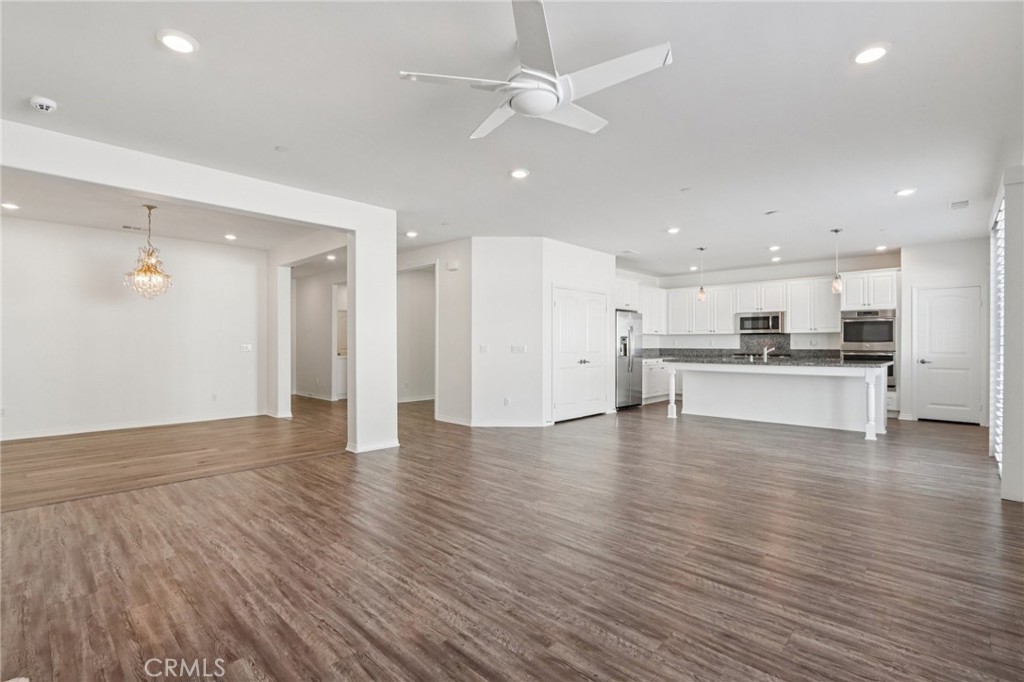 29594 Chelton Way Menifee, CA 92584 - Photo 11 of 48 a view of kitchen with wooden floor and window
