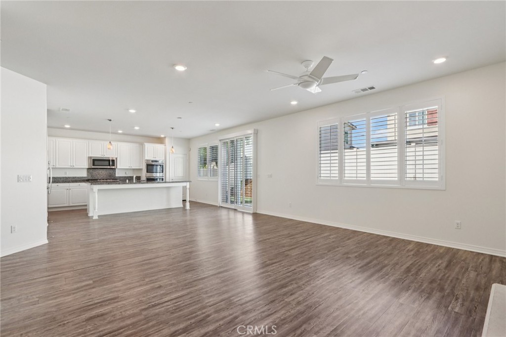 29594 Chelton Way Menifee, CA 92584 - Photo 13 of 48 a view of kitchen with wooden floor and window