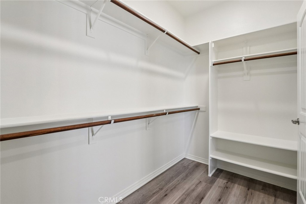 29594 Chelton Way Menifee, CA 92584 - Photo 22 of 48 a view of an empty walk in closet