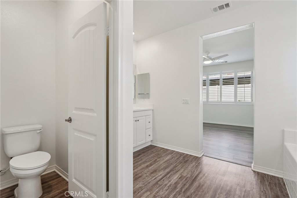 29594 Chelton Way Menifee, CA 92584 - Photo 23 of 48 a bathroom with a toilet and a sink
