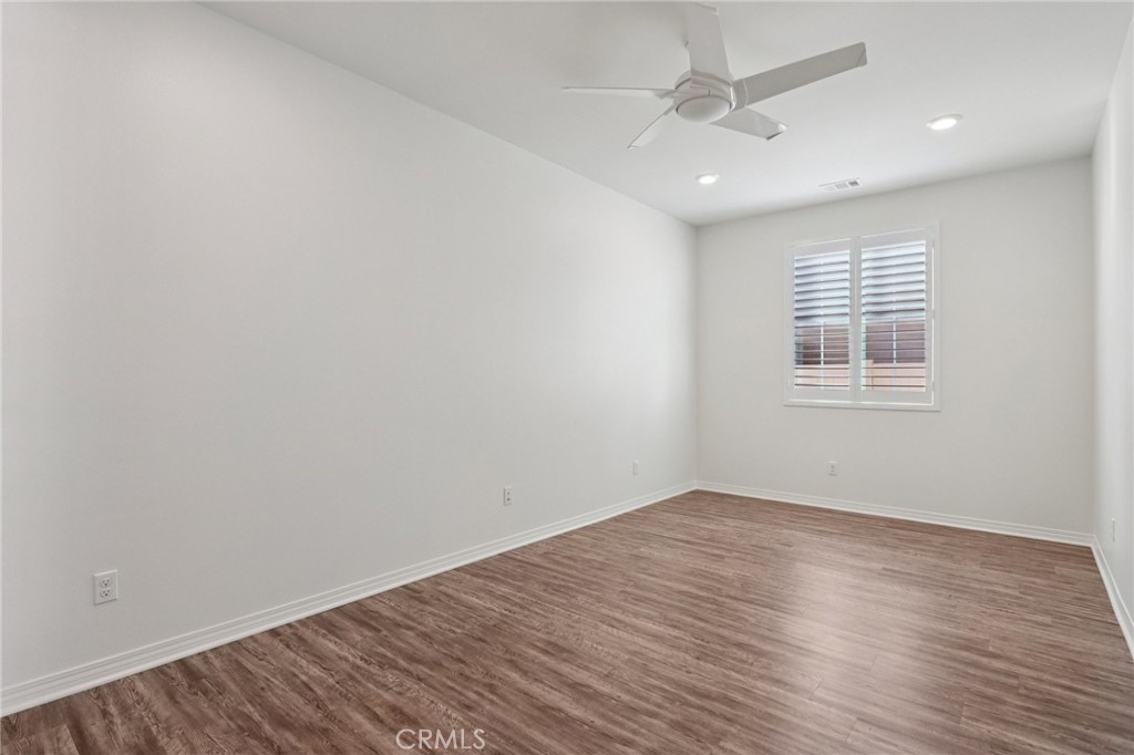 29594 Chelton Way Menifee, CA 92584 - Photo 24 of 48 wooden floor in an empty room with a window