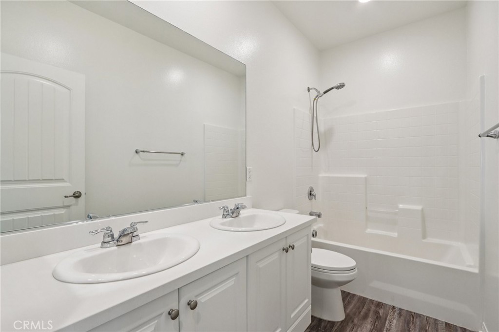 29594 Chelton Way Menifee, CA 92584 - Photo 27 of 48 a bathroom with a sink toilet and shower