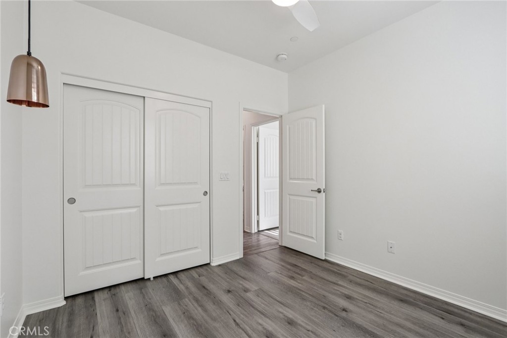 29594 Chelton Way Menifee, CA 92584 - Photo 31 of 48 a view of an empty room with wooden floor