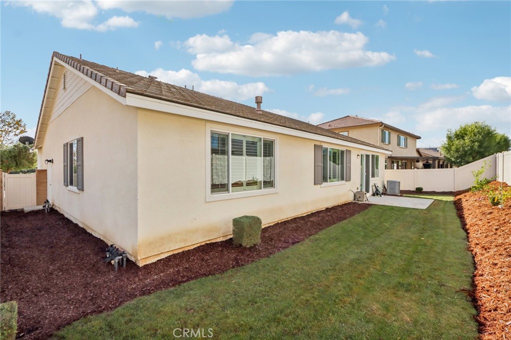 29594 Chelton Way Menifee, CA 92584 - Photo 34 of 48 a front view of a house with a yard