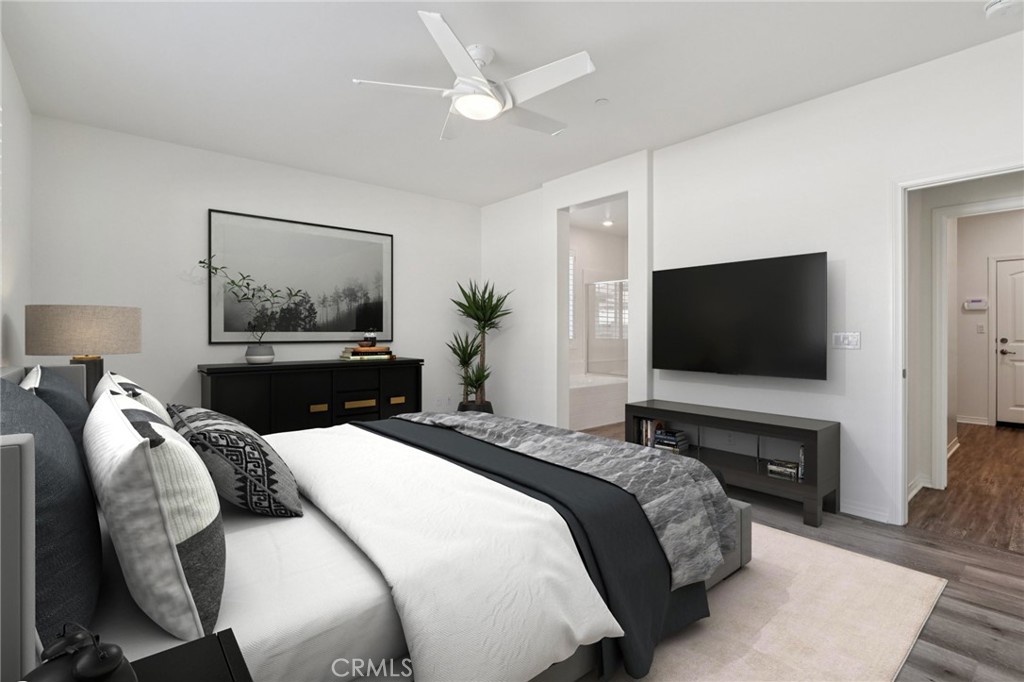 29594 Chelton Way Menifee, CA 92584 - Photo 5 of 48 a bedroom with a bed and a flat screen tv