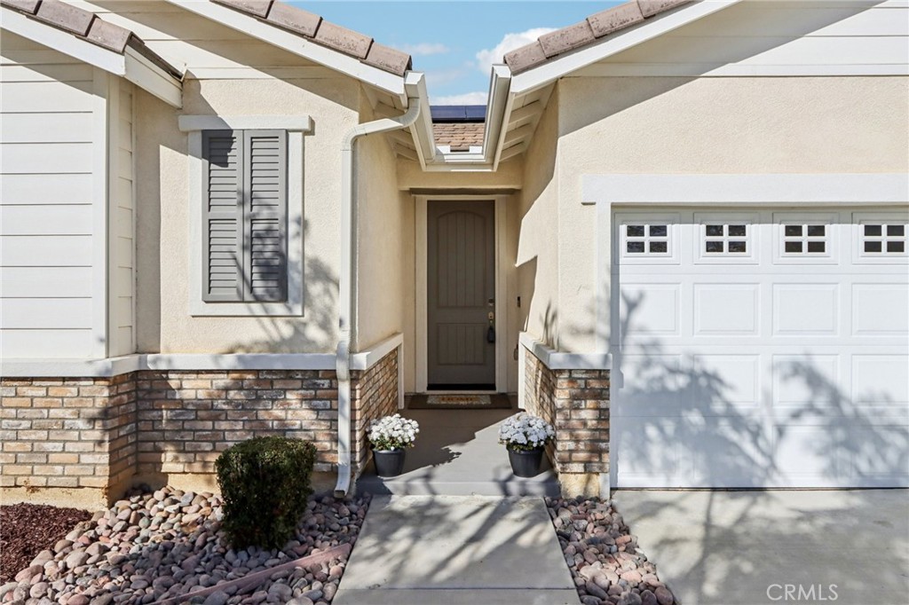 29594 Chelton Way Menifee, CA 92584 - Photo 10 of 48 a front view of a house with large windows