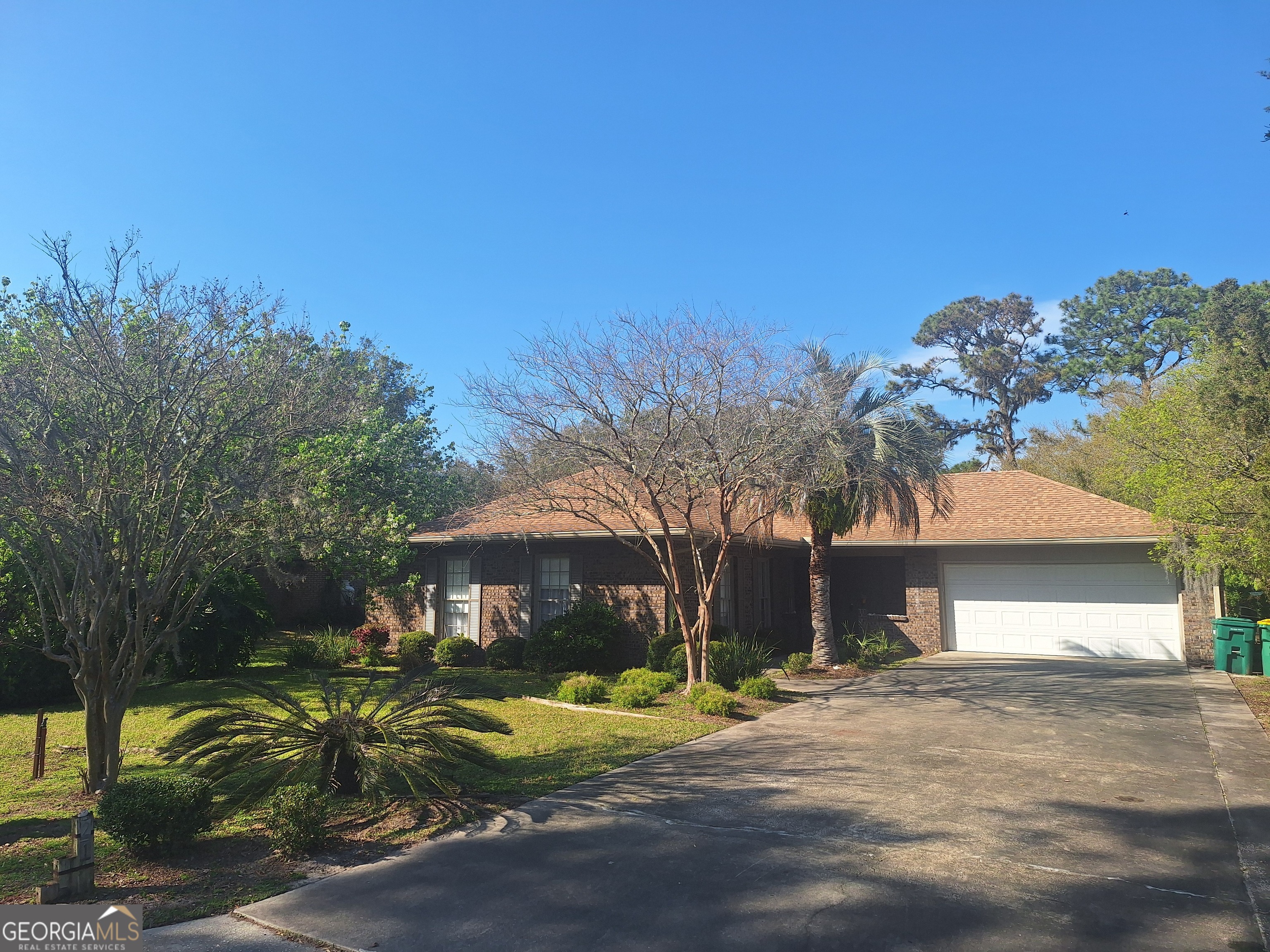 21 St Andrews Drive Jekyll Island, GA 31527 - Photo 1 of 30 a view of a house with a yard and tree s