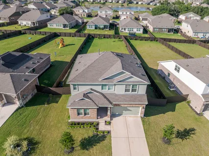 an aerial view of a house with a ocean view