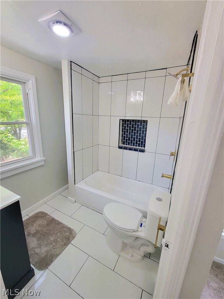 1557 Maplegrove Road South Euclid, OH 44121 - Photo 19 of 23 Full bathroom with tiled shower / bath, toilet, tile flooring, and vanity