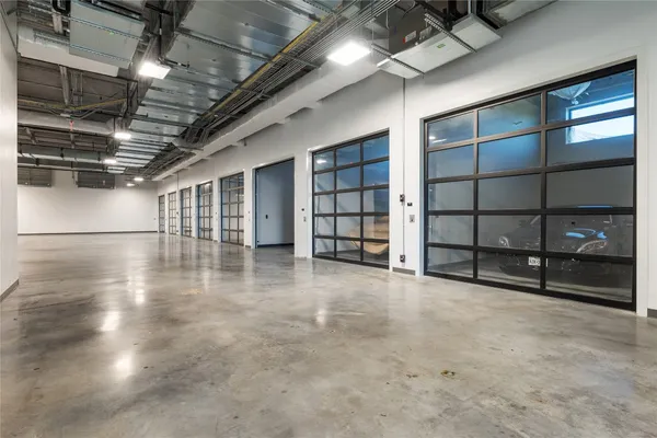 a view of an empty room with wooden shelves
