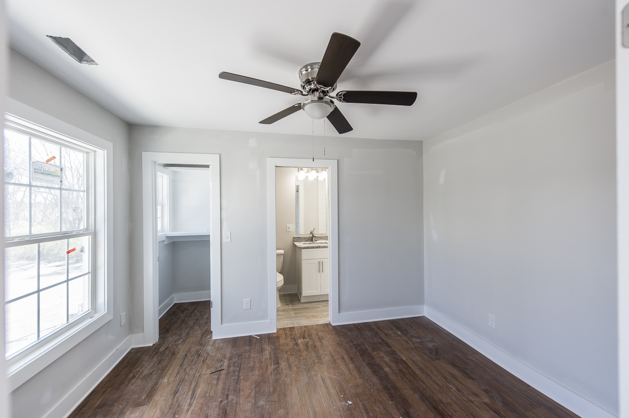 421 Elysian Fields Road, Unit 3 Nashville, TN 37211 - Photo 13 of 24 wooden floor in an empty room with a window