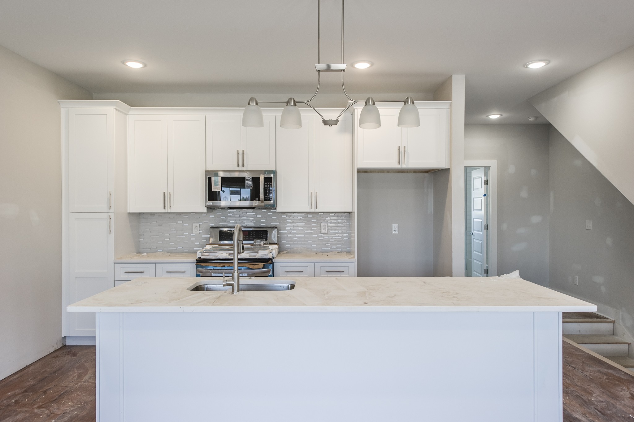 421 Elysian Fields Road, Unit 3 Nashville, TN 37211 - Photo 8 of 24 a kitchen with kitchen island a sink stainless steel appliances and cabinets