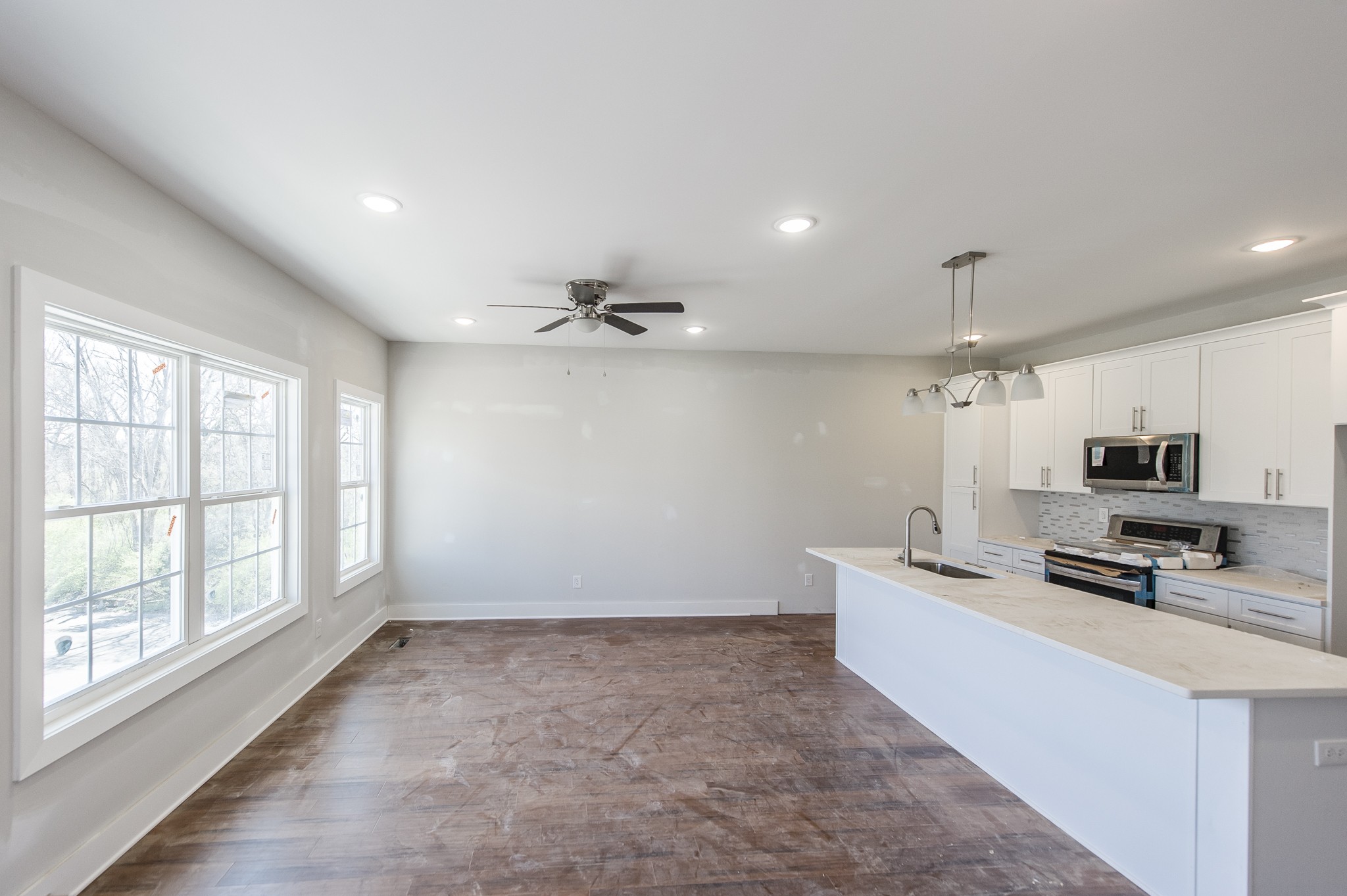 421 Elysian Fields Road, Unit 3 Nashville, TN 37211 - Photo 9 of 24 a large white kitchen with cabinets