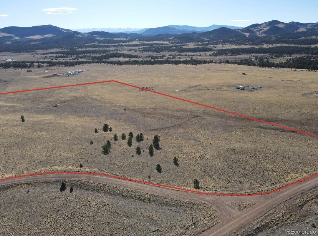 341 Lakeview Trail Guffey, CO 80820 - Photo 16 of 17 a view of a bath tub and a mountain in the background