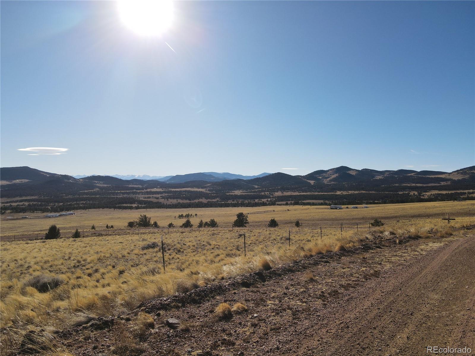 341 Lakeview Trail Guffey, CO 80820 - Photo 2 of 17 a view of lake with mountain