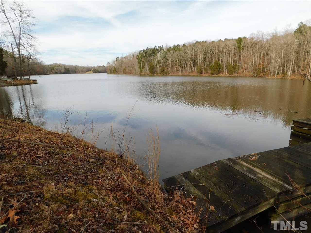 1575 Wilson Road Prospect Hill, NC 27314 - Photo 2 of 9 a view of a lake with a mountain
