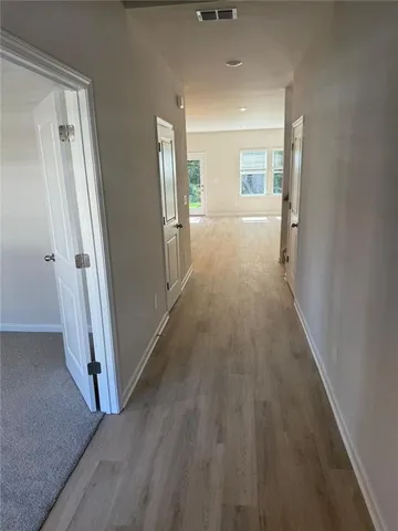 wooden floor in a hall with an entryway