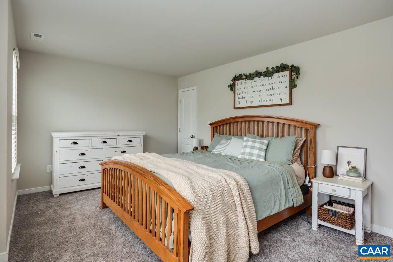 1090 Briery Farm Road Scottsville, VA 24590 - Photo 17 of 30 a bedroom with a bed and a window